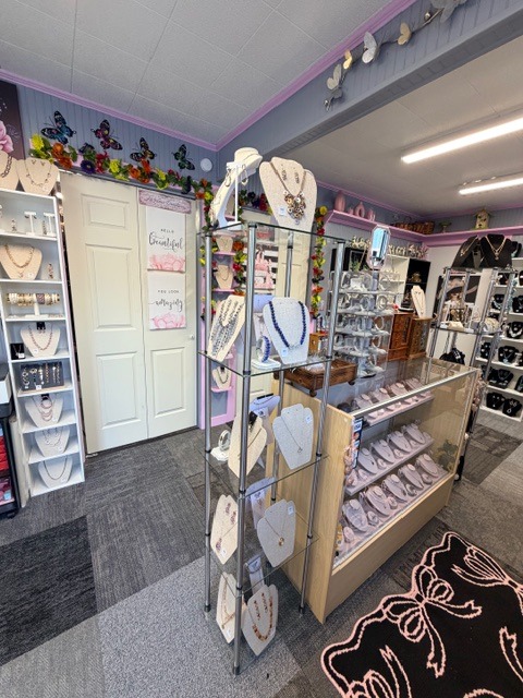 Boutique aisle with jewelry stands