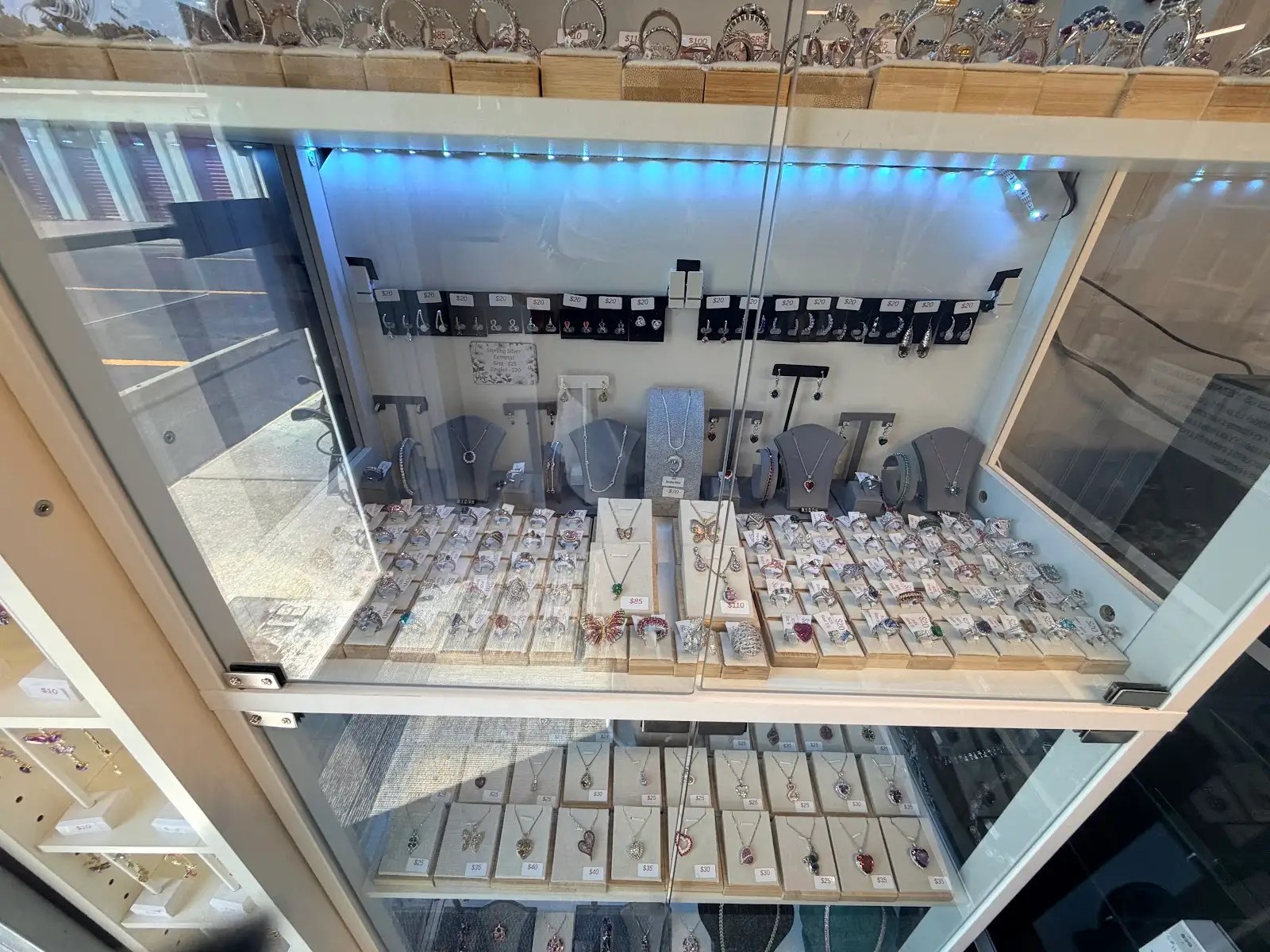 Top-down view of rings, earrings and necklaces