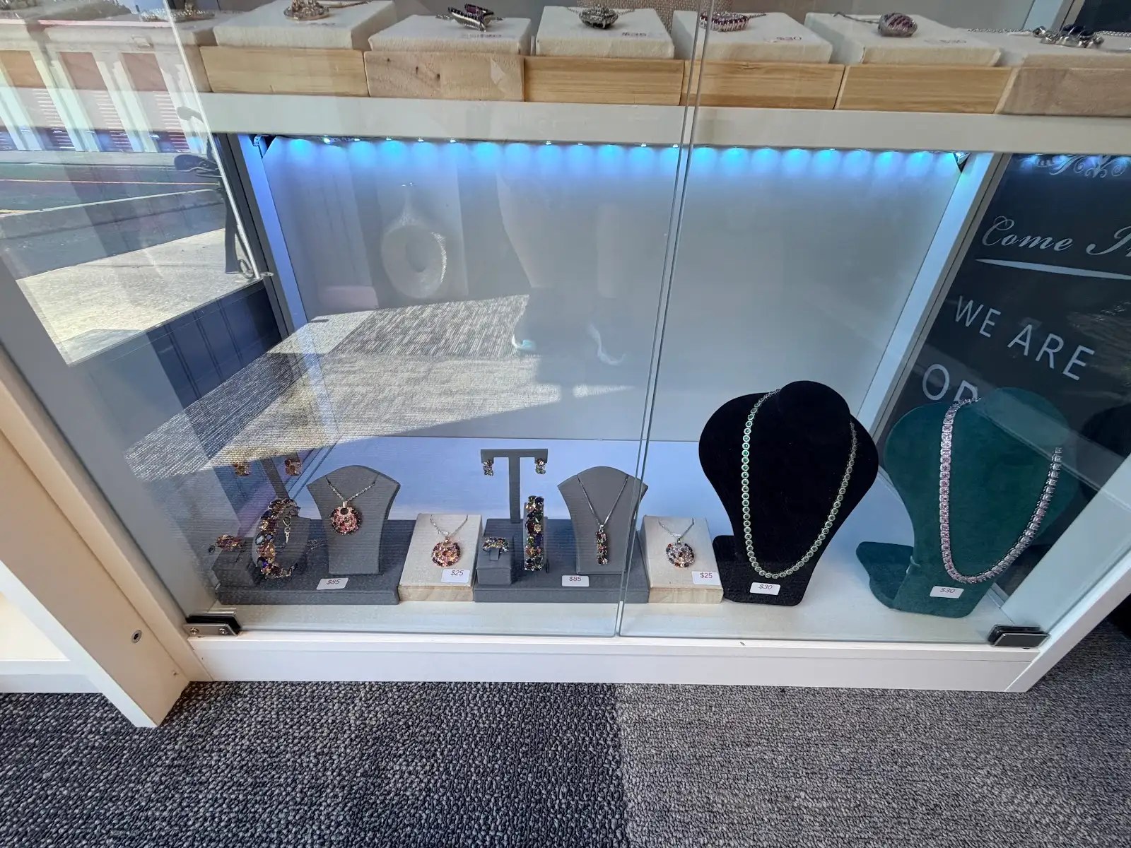 Jewelry window display with gemstone pieces