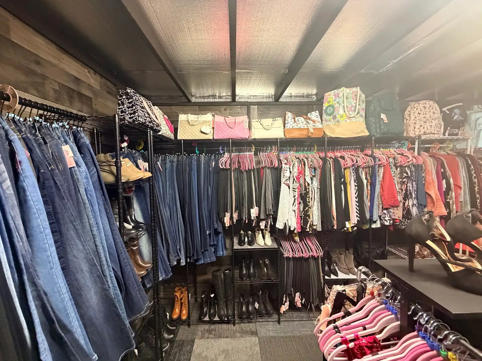Denim, dresses and boots in the clothing room