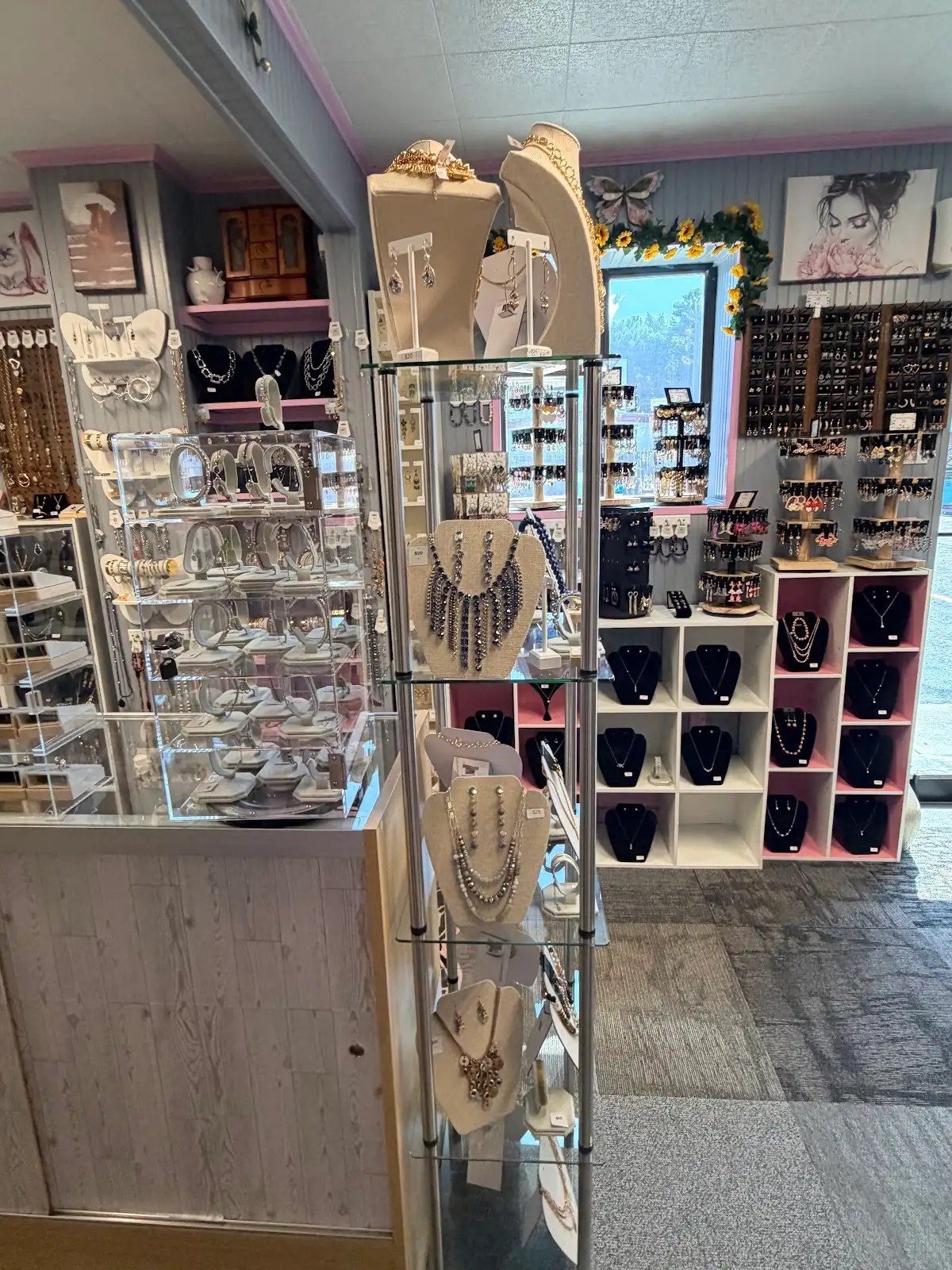 Glass jewelry tower and earring wall
