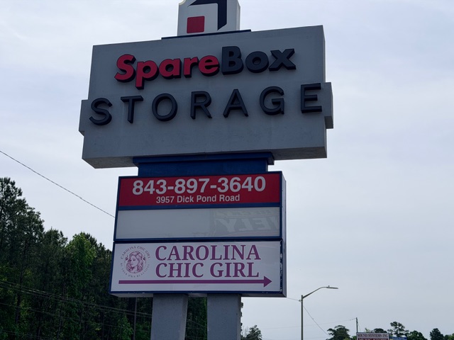 Carolina Chic Girl street sign on Dick Pond Road next to SpareBox Storage